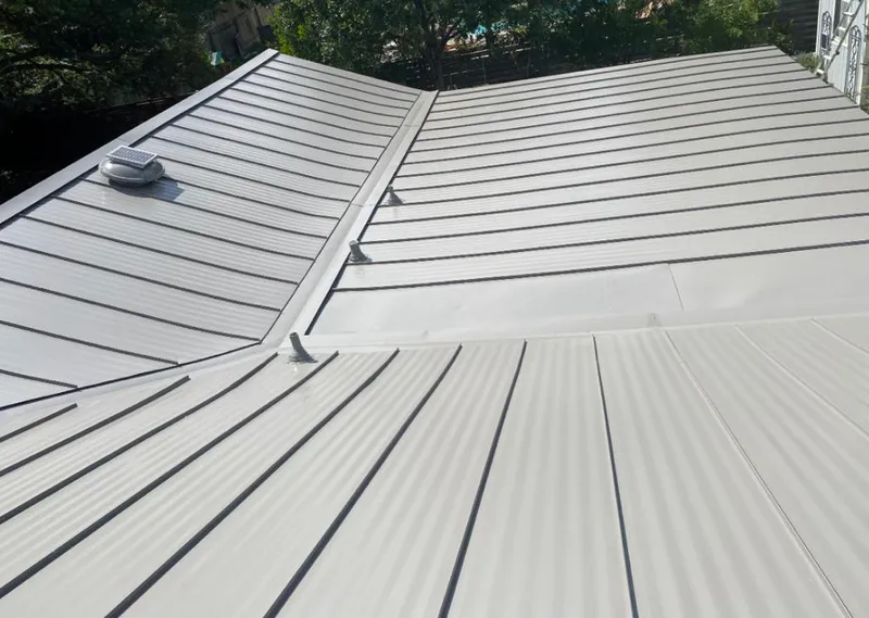 Solar attic fan installed on a metal roof for Roof Ventilation in Dyersburg